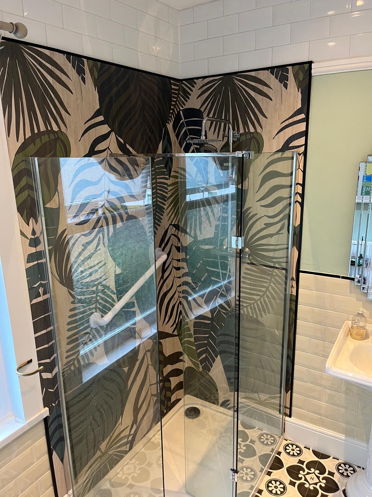 Walk-in shower with botanical wall panels